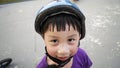 Asian boy wearing helmet and safety in skate or bike park. Royalty Free Stock Photo