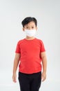 Asian boy wearing protective mask to protect pollution and the flu isolated on white background, Healthy concept Royalty Free Stock Photo