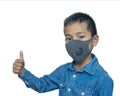 Asian boy wears a protective mask. COVID-19.