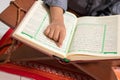 Asian boy who learns to read Al-Qur`an