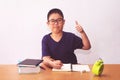 Asian boy writeing a book on table Royalty Free Stock Photo