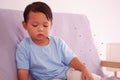 Cute asian child about 2 years old on the sofa in the living room and lots of mosquitoes are biting the little boy, Mosquitoes car Royalty Free Stock Photo