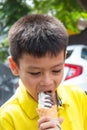 Asian boys are eating ice cream.