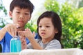 Asian boys and girls aged 4 to 8 years. Cute, bright faces are washing their hands with soap and water, washing hands with soap an