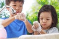 Asian boys and girls aged 4 to 8 years. Cute, bright faces are washing their hands with soap and water, washing hands with soap an