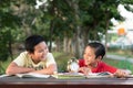 Asian boys laughing each other having fun time together at park in the evening Royalty Free Stock Photo