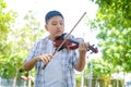 Asian boys are practicing playing violin music Royalty Free Stock Photo