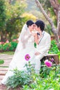 Asian Bride and Groom on Natural Background