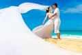 Asian bride and groom on a tropical beach. Wedding and honeymoon Royalty Free Stock Photo