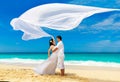 Asian bride and groom on a tropical beach. Wedding and honeymoon Royalty Free Stock Photo