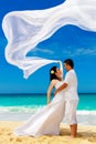 Asian bride and groom on a tropical beach. Wedding and honeymoon Royalty Free Stock Photo