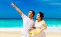 Asian bride and groom on a tropical beach. Wedding and honeymoon Royalty Free Stock Photo