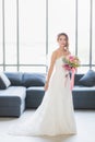 Asian bride standing and holding a bouquet Royalty Free Stock Photo