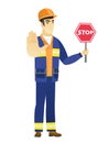 Asian builder holding stop road sign.