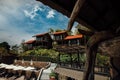 Asian bungalows with red roofs for rest and un beds for rest and sunbathing