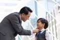 Asian business father and son confidence child want to be like a his dad parent and young boy standing in city with cityscape Royalty Free Stock Photo