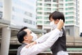 Asian business father and son are wearing face masks to prevent pollution and coronavirus in the city. Family businessman and son