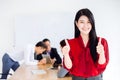 Asian business girl ceo show two hand thumb up good working together