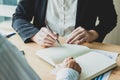 Asian business of hand holding pen reviewing and signing,Home buying contract,Selective focus Royalty Free Stock Photo