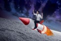 Asian business man flying ride rocket Royalty Free Stock Photo