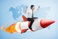 Asian business man flying ride rocket Royalty Free Stock Photo