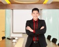 Asian business man with folded hand smiling Royalty Free Stock Photo