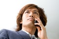 Asian business man and phone Royalty Free Stock Photo