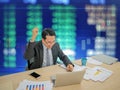 Asian business man sitting very happy Royalty Free Stock Photo