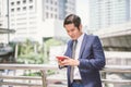 Asian business man talking reading his smart phone Royalty Free Stock Photo