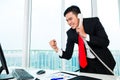 Asian business man telephoning in office Royalty Free Stock Photo