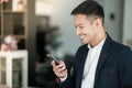 Asian business man using cell phone. Having Conversation, typing sms or presenting. Royalty Free Stock Photo