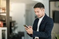 Asian business man using cell phone. Having Conversation, typing sms or presenting. Royalty Free Stock Photo