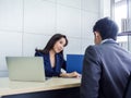 Asian business man and woman wearing suit working together in office Royalty Free Stock Photo