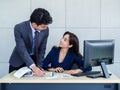 Asian business man and woman wearing suit working together in office Royalty Free Stock Photo