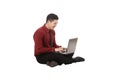 Asian business man working on a laptop and sitting on the floor Royalty Free Stock Photo