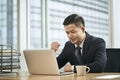 asian business man working in office using laptop computer Royalty Free Stock Photo