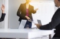 Asian business people in board room meeting,Team group discussing with hand raise up together in conference at office,Question and Royalty Free Stock Photo