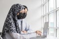 Asian business people group wearing protection face mask working and communicating at modern office desk together, brainstorm, dig Royalty Free Stock Photo