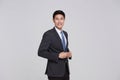 asian business people man good looking in studio. portrait businessman in grey suit confident friendly face Royalty Free Stock Photo