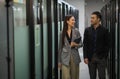 Asian business people man and woman walking and talking in office Royalty Free Stock Photo