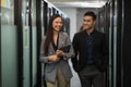 Asian business people man and woman walking and talking in office Royalty Free Stock Photo