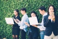 Asian business people meeting corporate digital device connection concept on tree wall Royalty Free Stock Photo