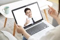Asian business people meeting online via video call using laptop computer Royalty Free Stock Photo