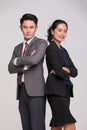 Asian business people stand back to back together Royalty Free Stock Photo