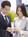 Asian business people using ipad