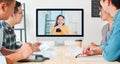 Asian business people video conference with colleague woman. Remote vdo call meeting, coworker teamwork brainstorm Royalty Free Stock Photo