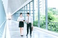 Asian Business people walking and talking outside office. Royalty Free Stock Photo