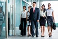 Asian business team marching into office