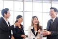 Asian business team smiling during talking and meeting while having a coffee break in the office. Asian business group brainstorm Royalty Free Stock Photo