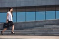 Business Woman with Attache Case Walking in City Royalty Free Stock Photo